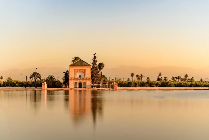 Saadian_pavilion_Menara_gardens_and_Atlas_in_Marrakech_AdobeStock_210837234.jpg